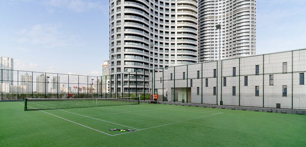 Lodha World Towers, Worli– Residential Project in Mumbai  Rooftop tennis court with skyline view 
